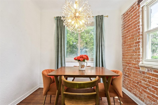 dining room featuring wood-type flooring and an inviting chandelier