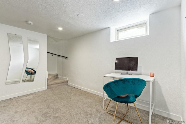 living area featuring a textured ceiling and light colored carpet