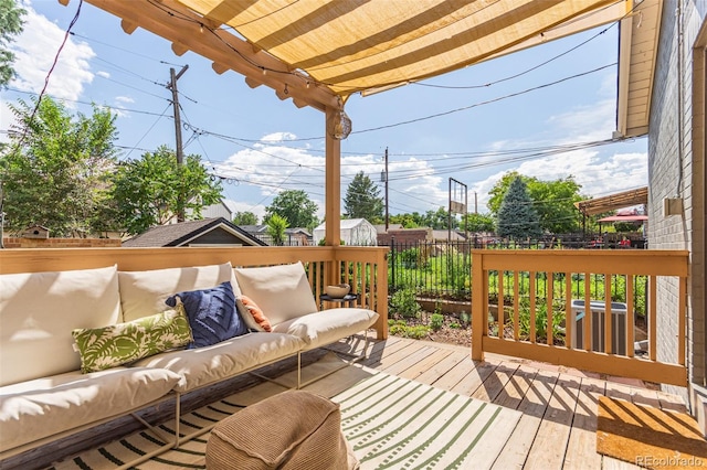 wooden terrace featuring an outdoor living space