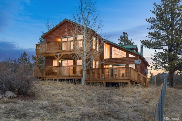 back of property featuring metal roof