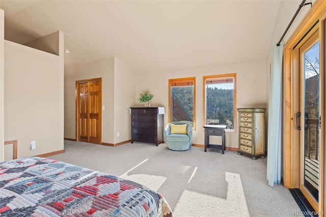 carpeted bedroom featuring baseboards