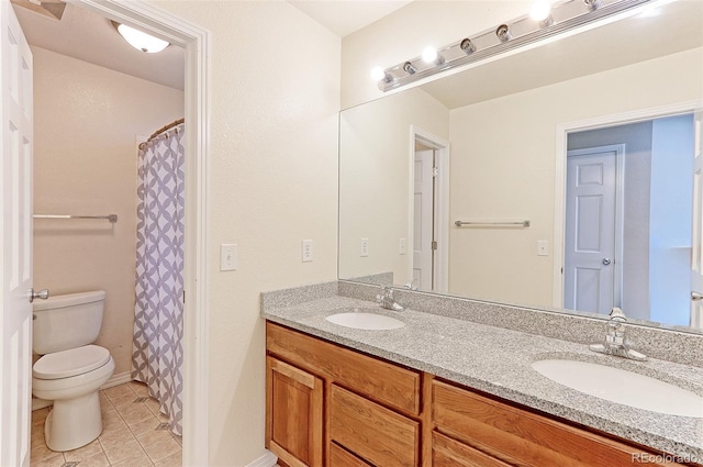 2901 Madison Ln, Broomfield, CO 80023 - bathroom with toilet, double vanity, tile patterned floors, baseboards, and a shower with shower curtain