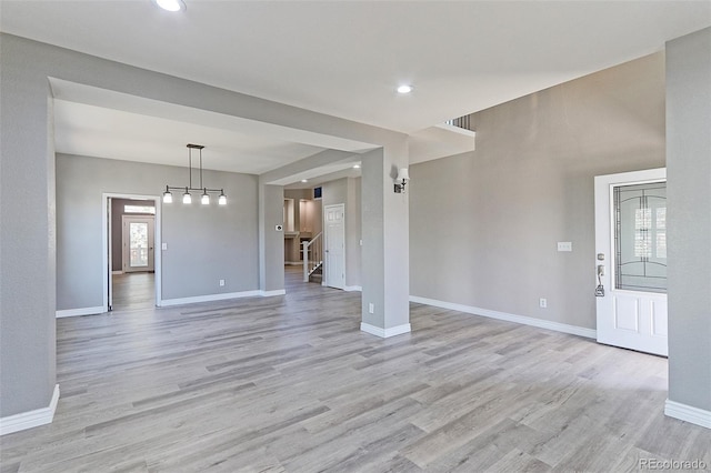 2901 Madison Ln, Broomfield, CO 80023 - unfurnished living room featuring light wood-type flooring, baseboards, and recessed lighting