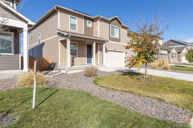 view of front of home featuring a garage and a front lawn