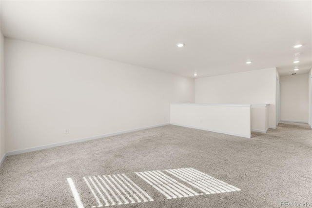 spare room with light colored carpet