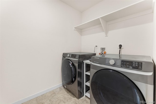 laundry room featuring separate washer and dryer