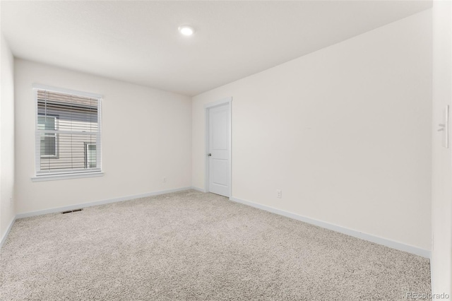 empty room with carpet flooring