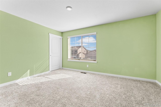 unfurnished room featuring carpet floors