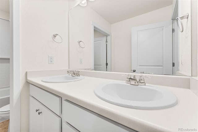 bathroom with vanity and toilet