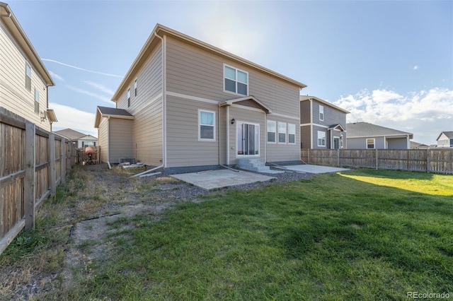 rear view of house featuring a patio, central AC, and a lawn