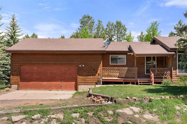 1908 Valley View Dr, Woodland Park, CO 80863 - view of front of property featuring a garage, driveway, and a front yard