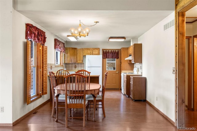 1908 Valley View Dr, Woodland Park, CO 80863 - dining room featuring wood finished floors and a chandelier