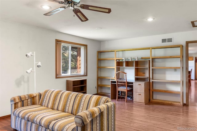 1908 Valley View Dr, Woodland Park, CO 80863 - living area featuring wood finished floors, ceiling fan, built in study area, and recessed lighting