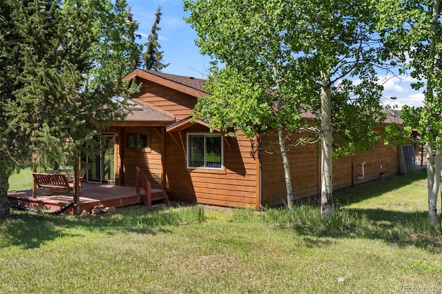 1908 Valley View Dr, Woodland Park, CO 80863 - back of house with a yard, a wooden deck, and a shingled roof