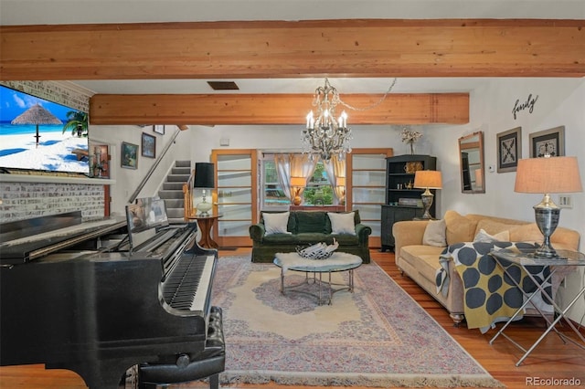 233 Perry Park Ave, Larkspur, CO 80118 - living room featuring wood finished floors, a chandelier, stairs, and beam ceiling