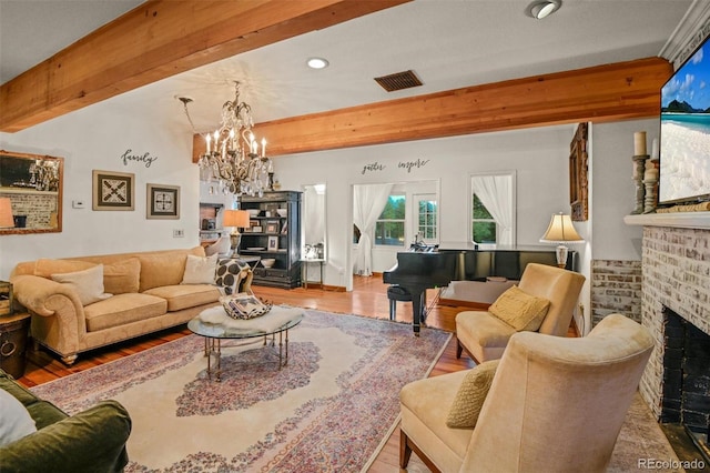 233 Perry Park Ave, Larkspur, CO 80118 - living room featuring wood finished floors, a brick fireplace, a chandelier, recessed lighting, and beamed ceiling