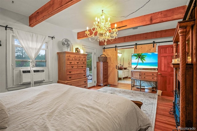 233 Perry Park Ave, Larkspur, CO 80118 - bedroom featuring a barn door, beam ceiling, wood finished floors, access to outside, and a chandelier