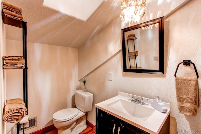 233 Perry Park Ave, Larkspur, CO 80118 - bathroom with vanity and a textured wall