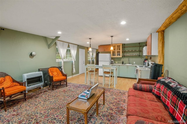 233 Perry Park Ave, Larkspur, CO 80118 - living room with heating unit, light wood-style floors, recessed lighting, and a textured ceiling