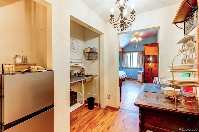233 Perry Park Ave, Larkspur, CO 80118 - corridor featuring wood finished floors and a chandelier
