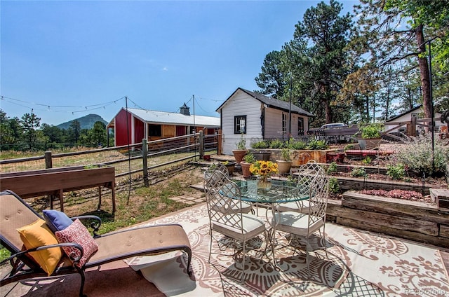 233 Perry Park Ave, Larkspur, CO 80118 - view of patio / terrace featuring a garden and outdoor dining space