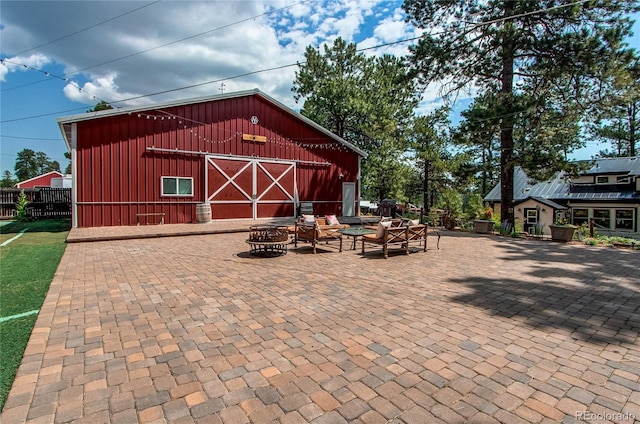 233 Perry Park Ave, Larkspur, CO 80118 - view of patio / terrace with an outbuilding and a fire pit