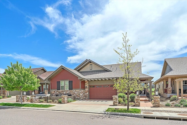 1130 Summit View Dr, Louisville, CO 80027 - view of front of house with a garage, driveway, stone siding, and a shingled roof