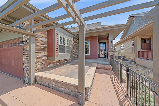 1130 Summit View Dr, Louisville, CO 80027 - view of patio / terrace featuring a garage