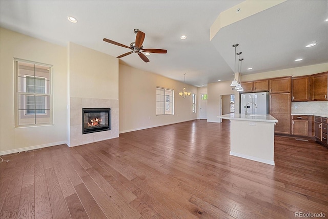 1130 Summit View Dr, Louisville, CO 80027 - unfurnished living room featuring dark wood-style floors, a fireplace, ceiling fan, recessed lighting, and baseboards