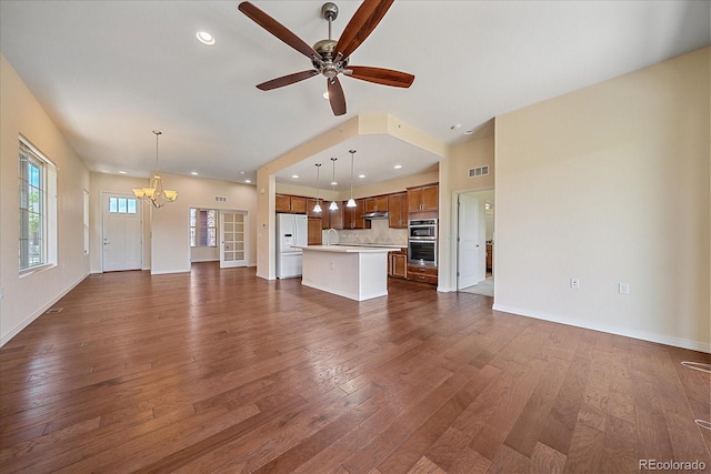 1130 Summit View Dr, Louisville, CO 80027 - unfurnished living room featuring a chandelier, dark wood-style floors, baseboards, a ceiling fan, and recessed lighting