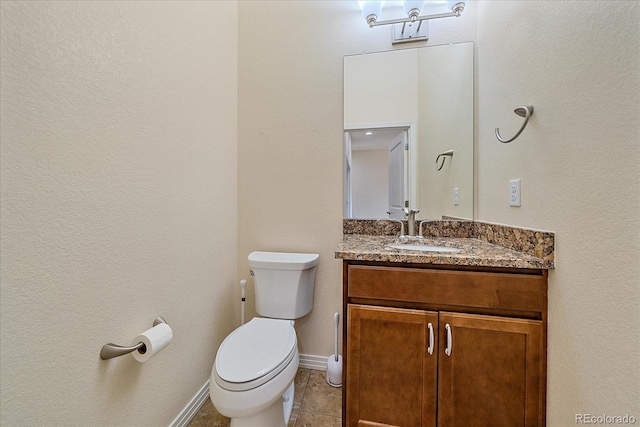 1130 Summit View Dr, Louisville, CO 80027 - bathroom with toilet, vanity, tile patterned flooring, and baseboards