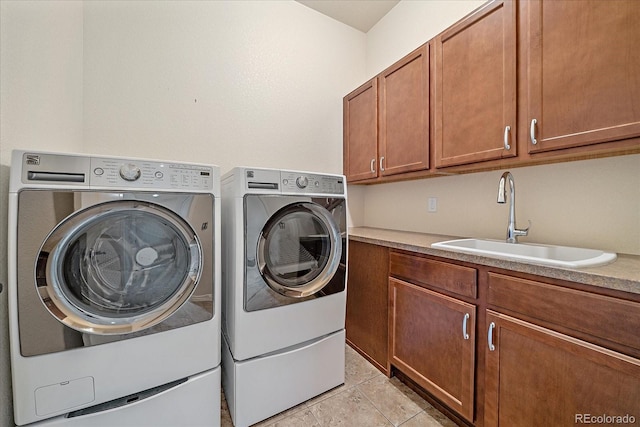 1130 Summit View Dr, Louisville, CO 80027 - clothes washing area with washer and clothes dryer and cabinet space