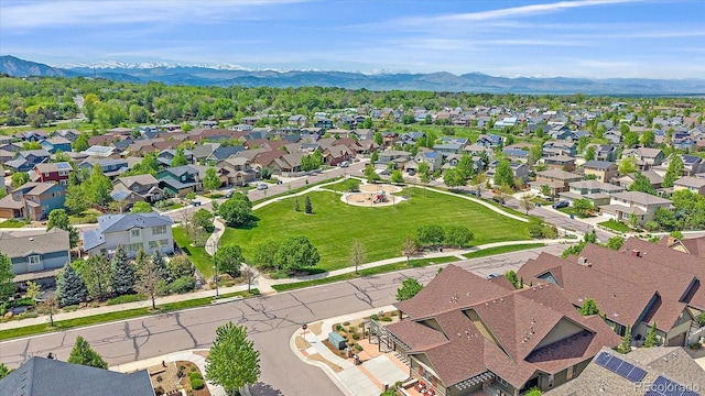 1130 Summit View Dr, Louisville, CO 80027 - aerial overview of property's location featuring a mountainous background and nearby suburban area