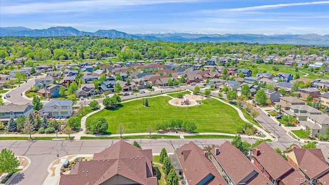 1130 Summit View Dr, Louisville, CO 80027 - aerial overview of property's location with a mountainous background and nearby suburban area