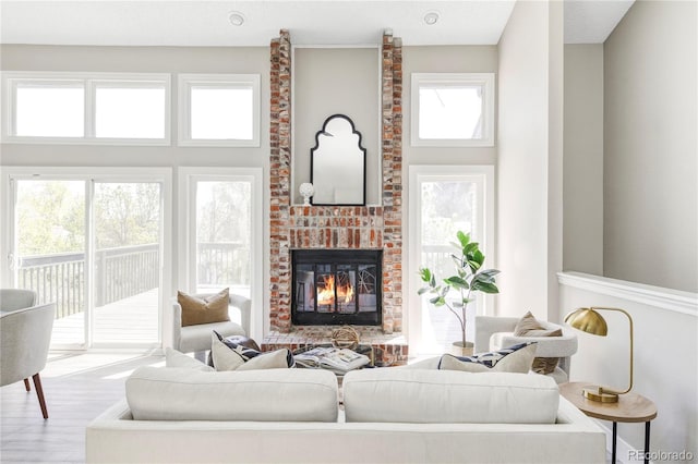 3328 S Danube St, Aurora, CO 80013 - living area with a fireplace and wood finished floors