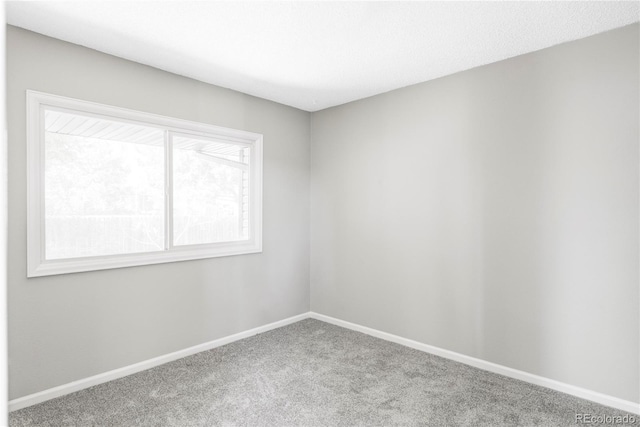 3328 S Danube St, Aurora, CO 80013 - carpeted spare room with baseboards