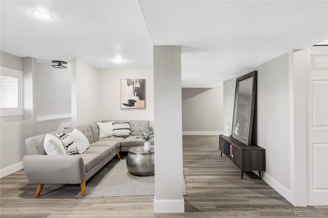 3328 S Danube St, Aurora, CO 80013 - living room featuring wood finished floors, baseboards, and recessed lighting