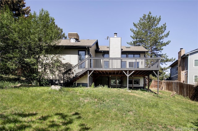 3328 S Danube St, Aurora, CO 80013 - back of property with stairway, a deck, and a chimney