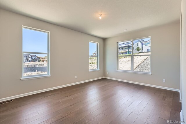 4748 Weitbrec Ln, Castle Rock, CO 80104 - empty room with baseboards and dark wood finished floors