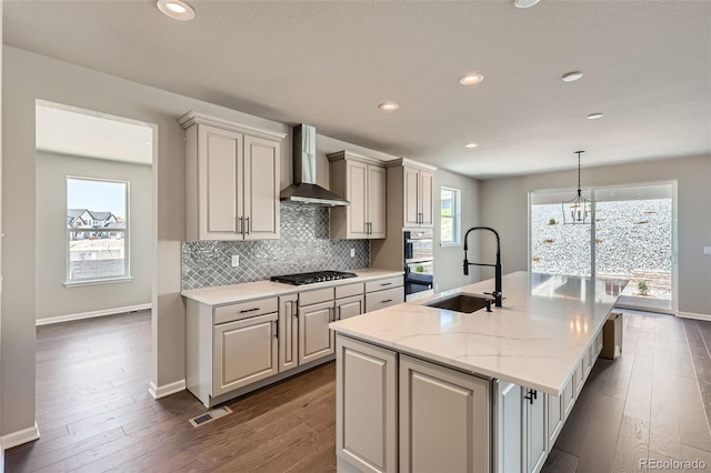 4748 Weitbrec Ln, Castle Rock, CO 80104 - kitchen with wall chimney exhaust hood, a sink, an island with sink, dark wood-type flooring, and decorative backsplash