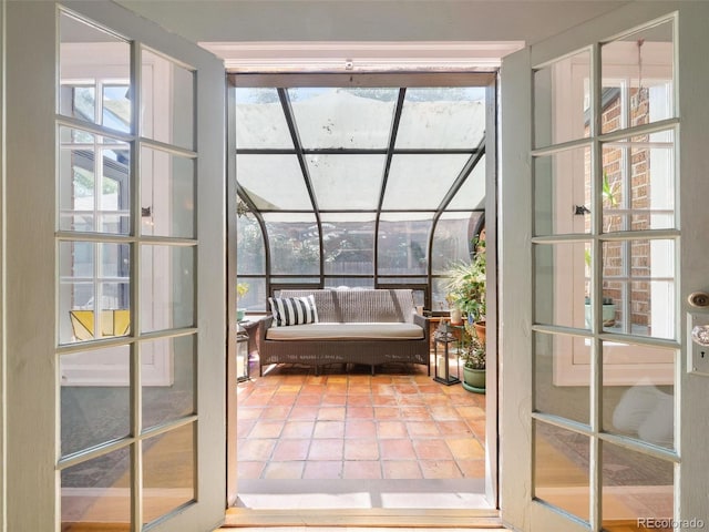 doorway with tile patterned floors