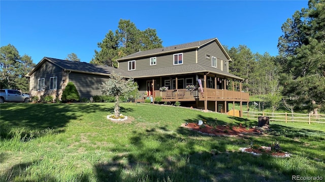 back of house with a deck