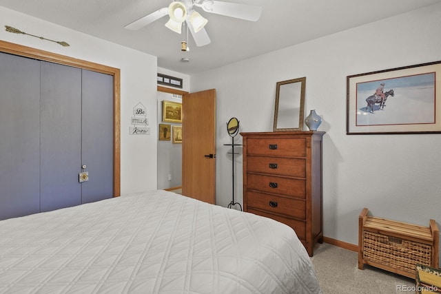 carpeted bedroom featuring a closet, ceiling fan, and baseboards