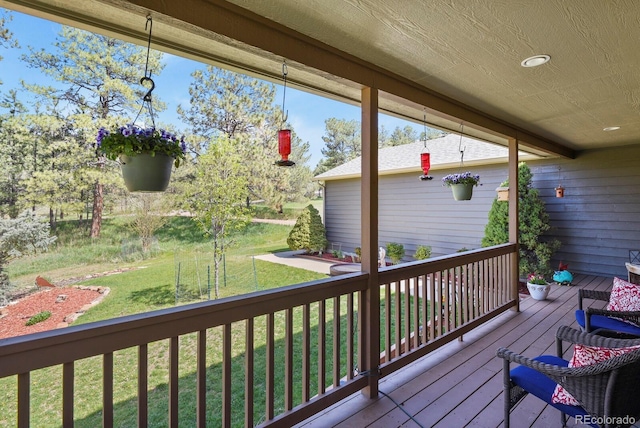 deck featuring a lawn