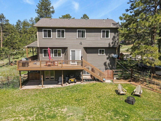 back of property featuring a wooden deck, a patio, an outdoor fire pit, and stairway