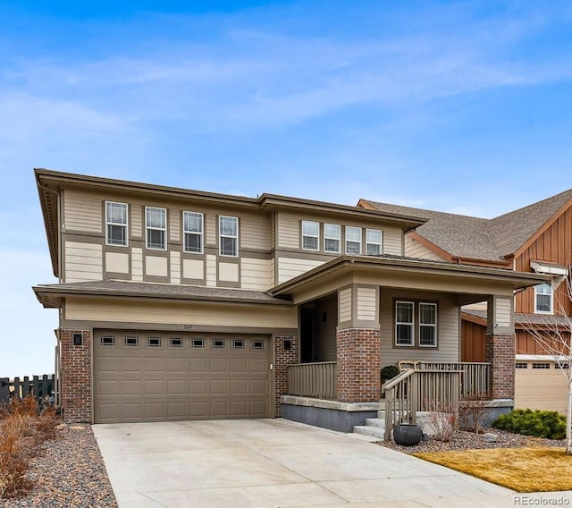 view of front of house with a garage, concrete driveway, and brick siding