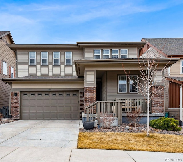 view of front facade featuring covered porch, brick siding, driveway, and an attached garage