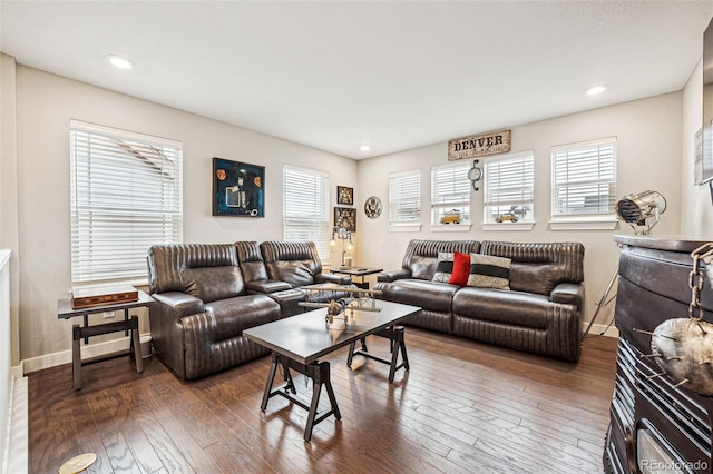 living room with hardwood / wood-style floors, recessed lighting, and baseboards