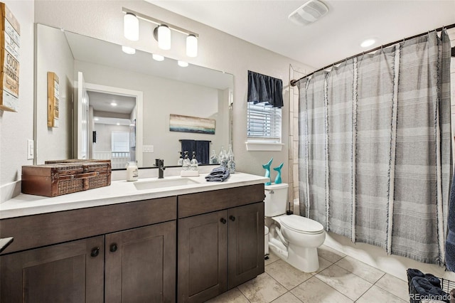 full bathroom featuring shower / bath combination with curtain, visible vents, toilet, vanity, and tile patterned floors