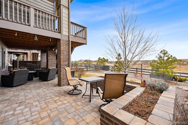 view of patio / terrace featuring a fenced backyard, an outdoor hangout area, and outdoor dining area